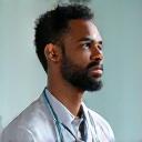 Professional man, David R., 55, with a thoughtful expression, representing a healthcare professional.