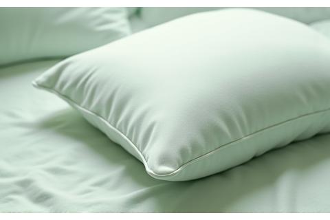 A close-up of a luxurious, ergonomic pillow and mattress corner.